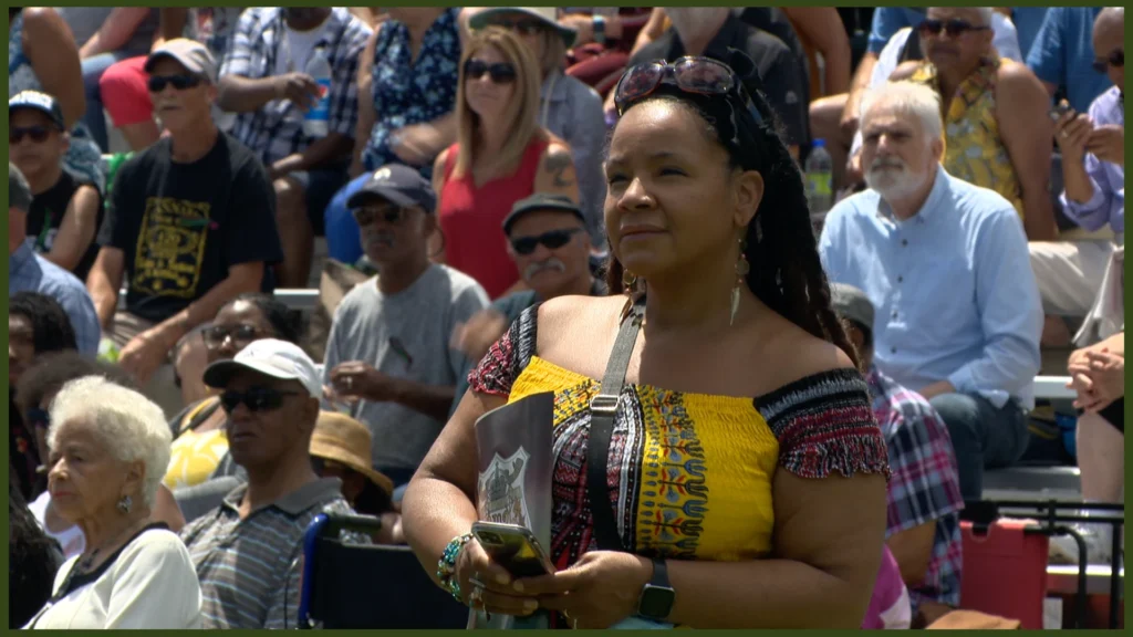 Unknown woman listens to the apology to descendants of the No. 2 Construction Battalion